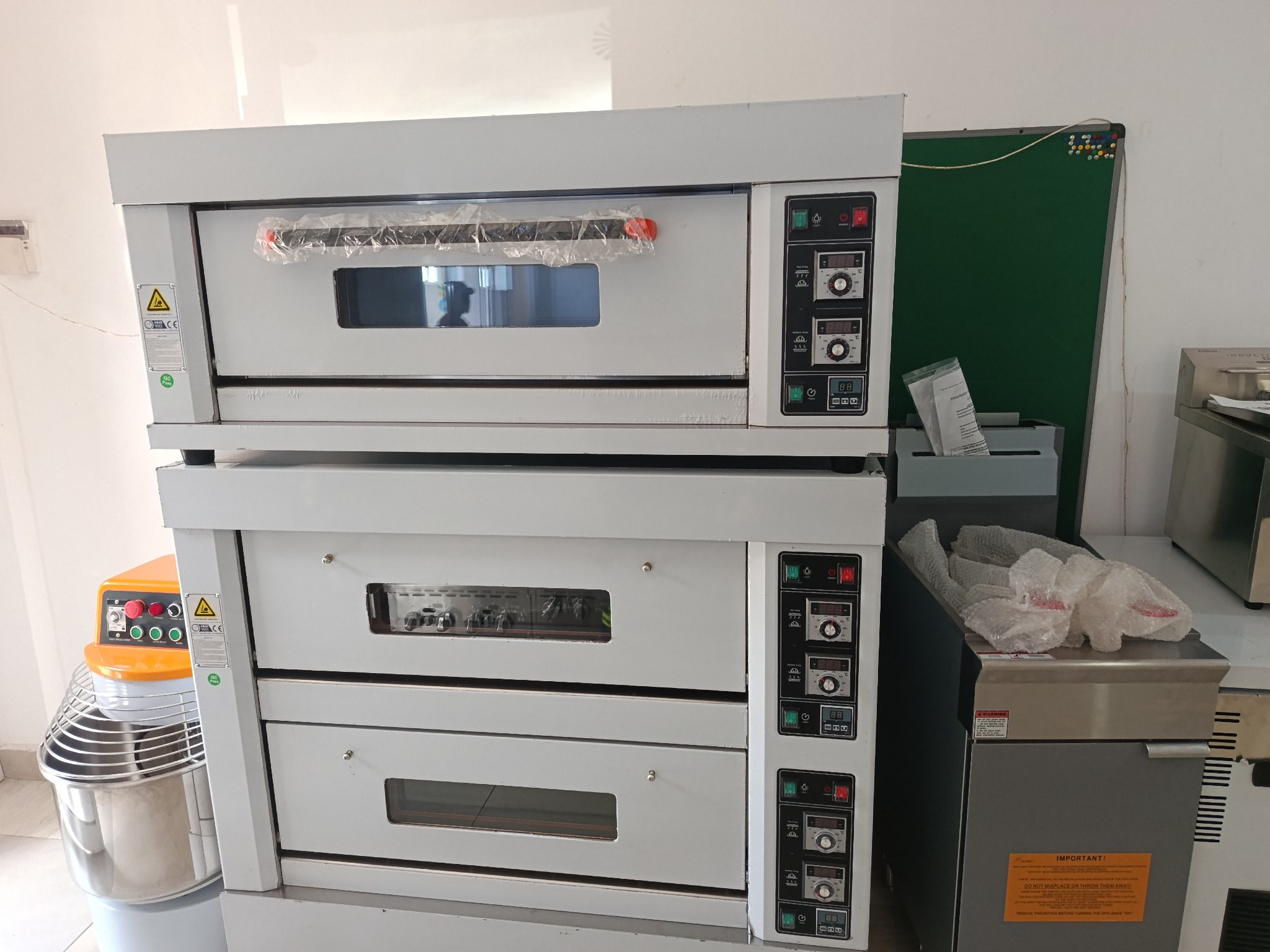Technician working on kitchen equipment